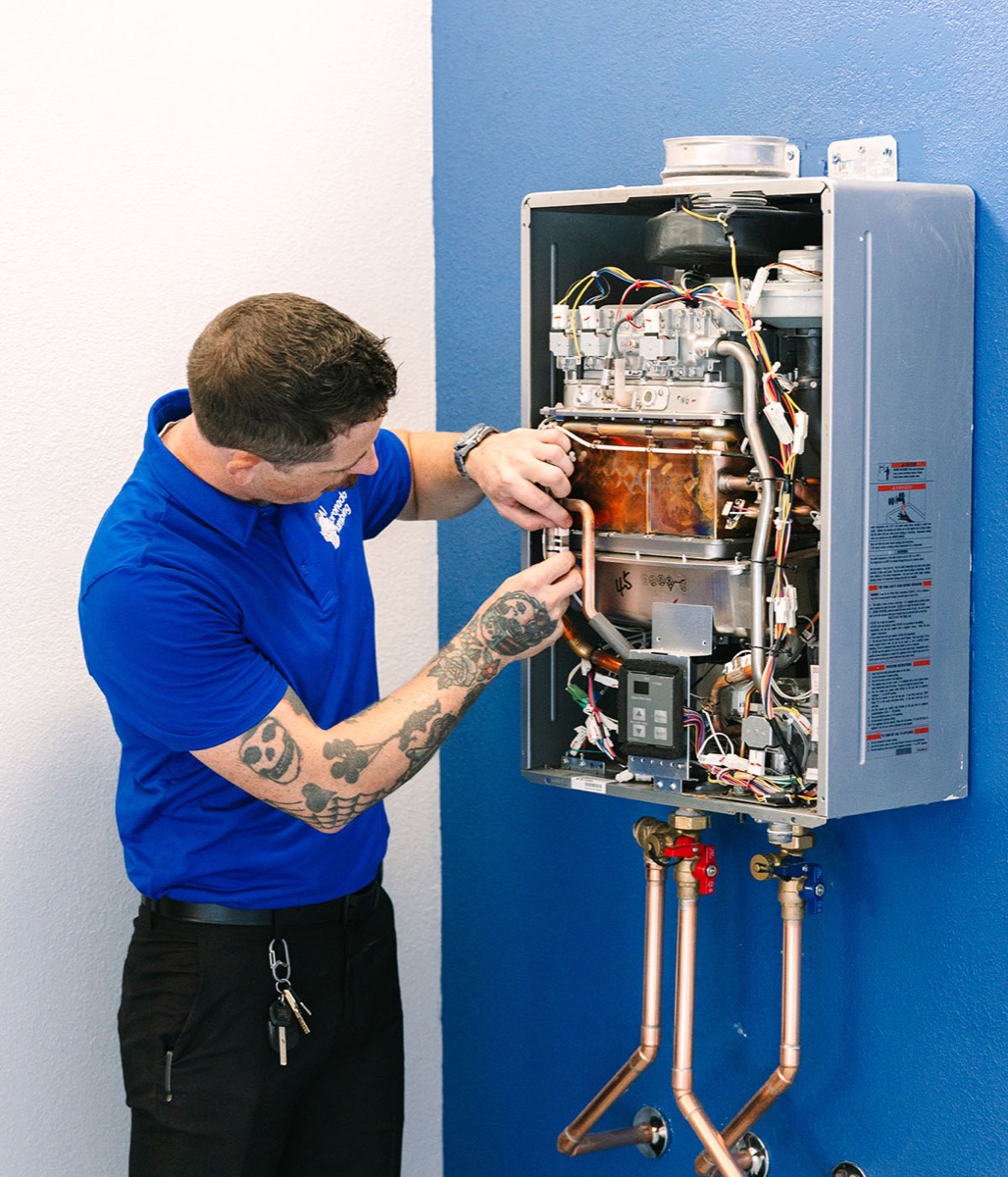 Al Coronado technician working on a water heater installation.