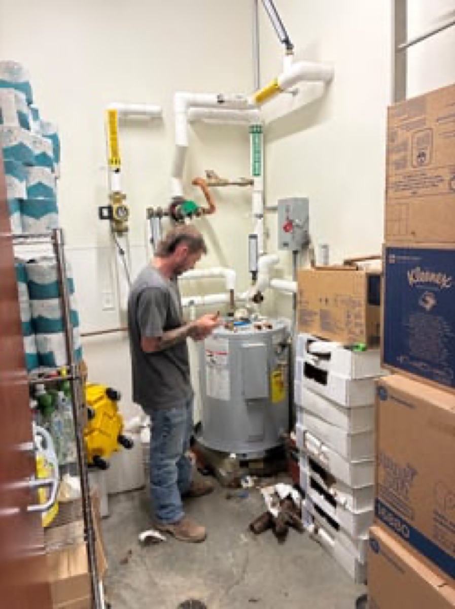 Technicians on a specialty water heater job for a local city (per the site's caption)