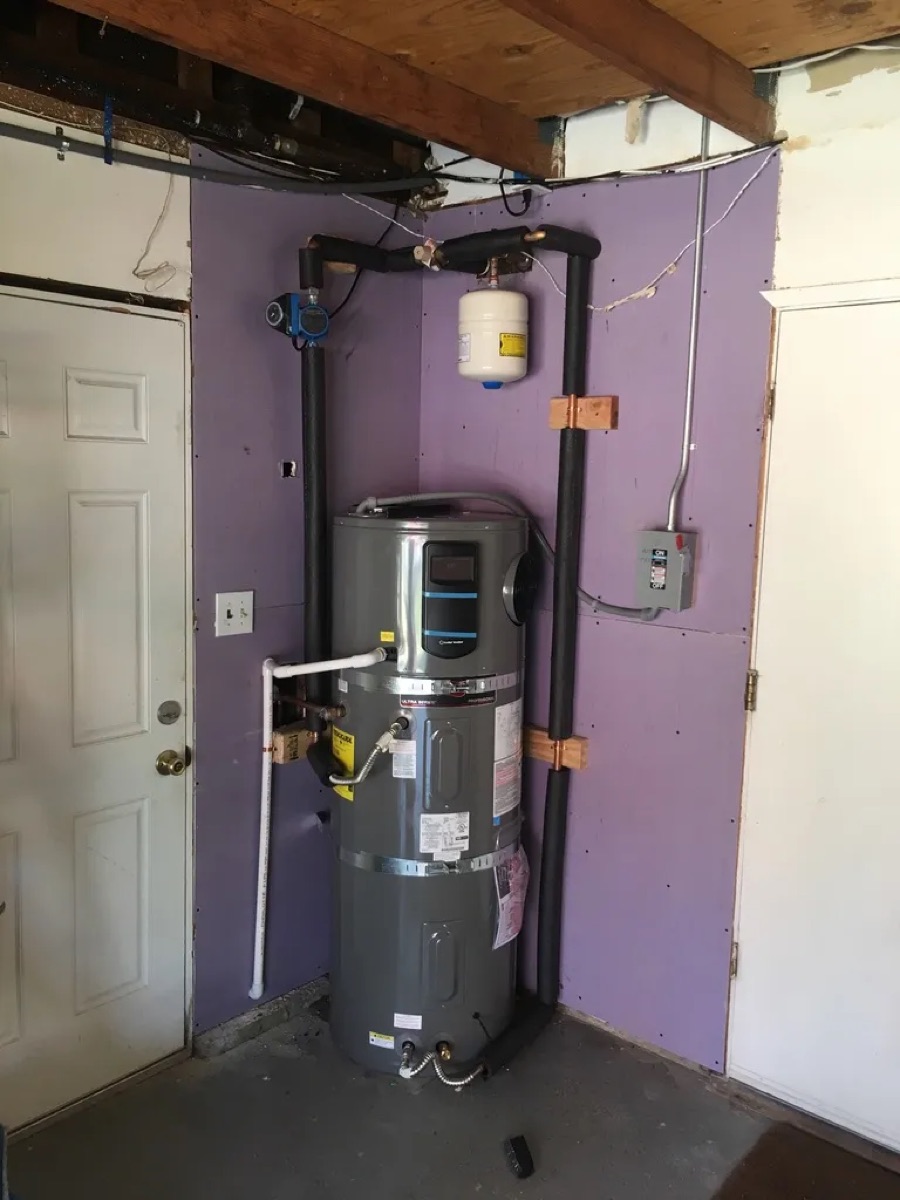 Water heater tank installed in a basement (homepage work gallery)