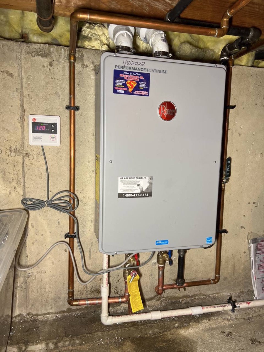 Wall-mounted Rheem tankless water heater installation