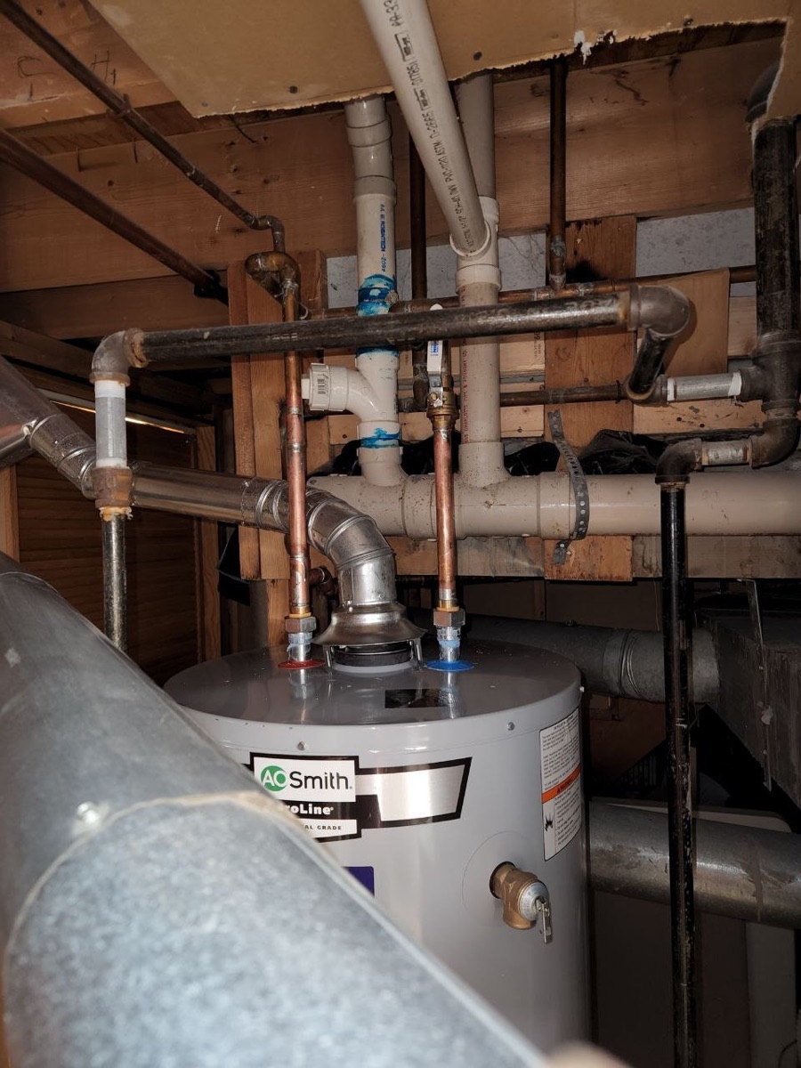 A.O. Smith tank water heater with new venting in a basement