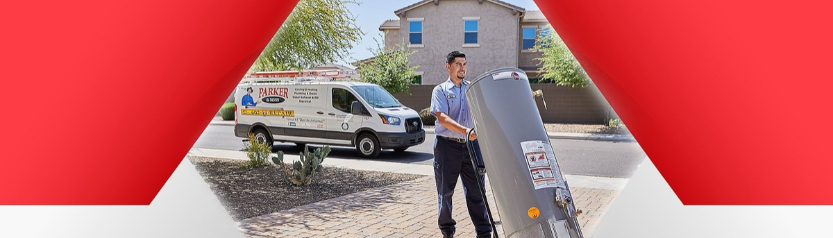 Technician pushing new water heater on dolly (site alt text)