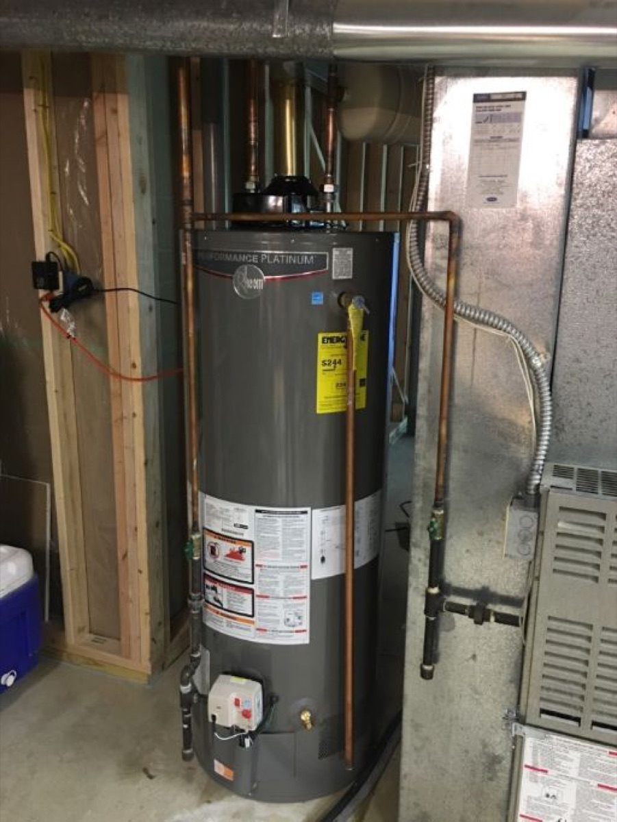 Gas tank water heater installed next to a furnace (gallery file name references 63368)