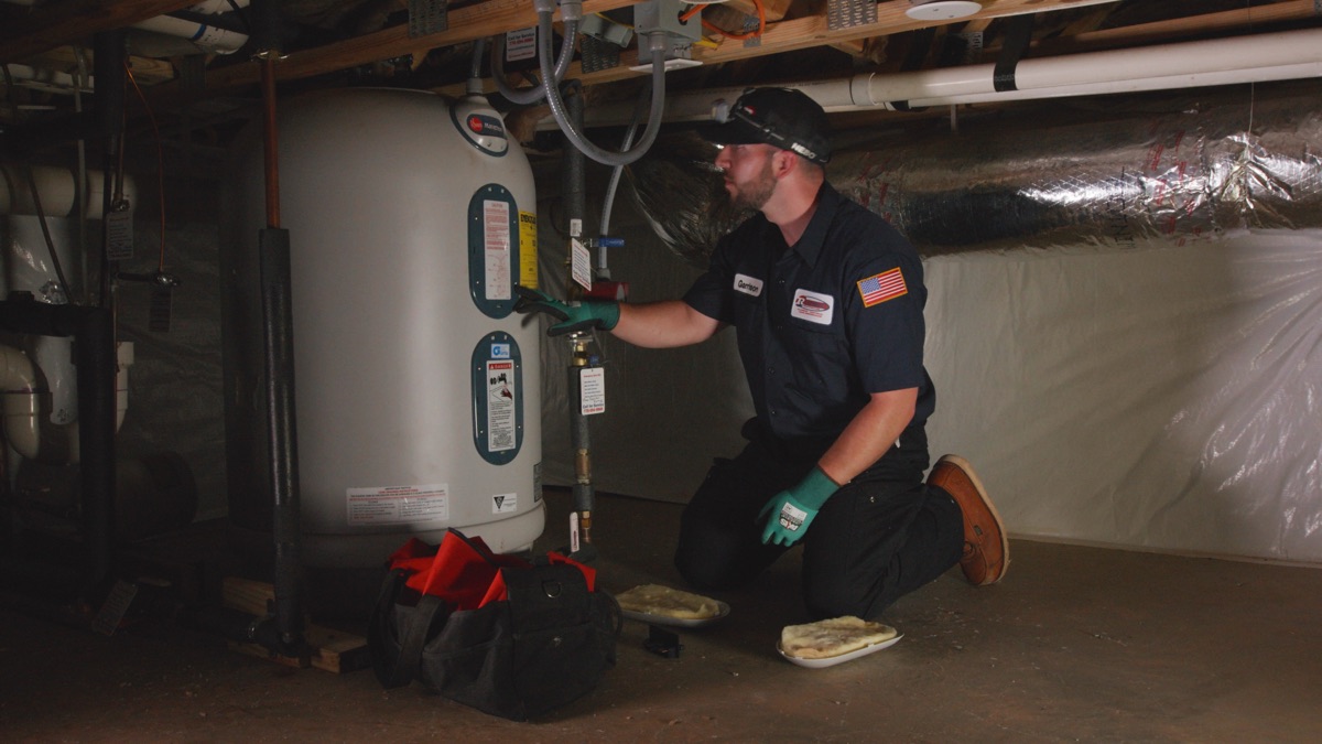Technician working on a water heater