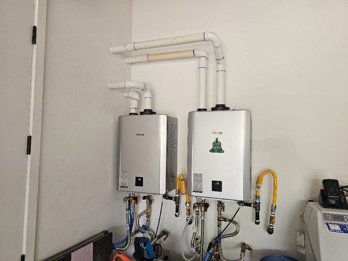 Two Rinnai tankless water heaters with recirculation pumps installed by Sentinel Plumbing in South Las Vegas, Nevada