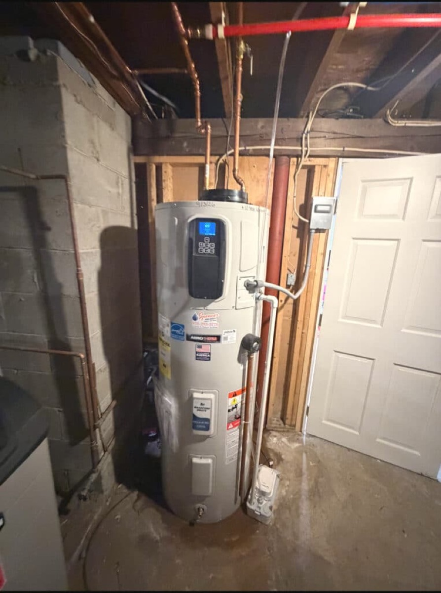 Heat-pump water heater installed by Spencer Home Services (per site alt text)