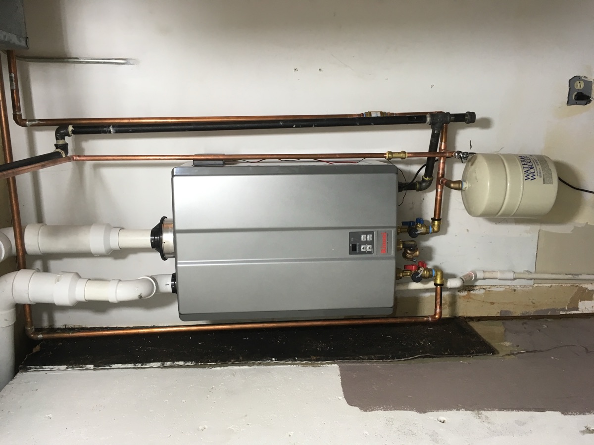Wall-mounted tankless water heater with expansion tank and new piping