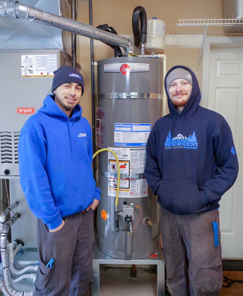 Washington Energy Services installers beside a newly installed gas tank water heater