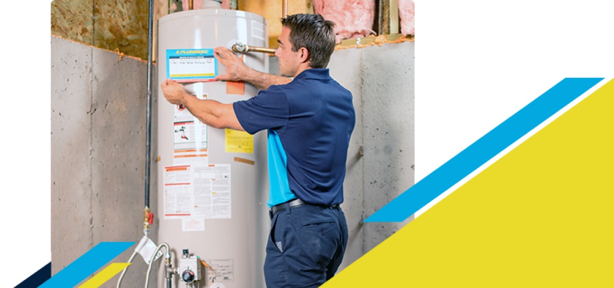 Technician placing a label on a water heater