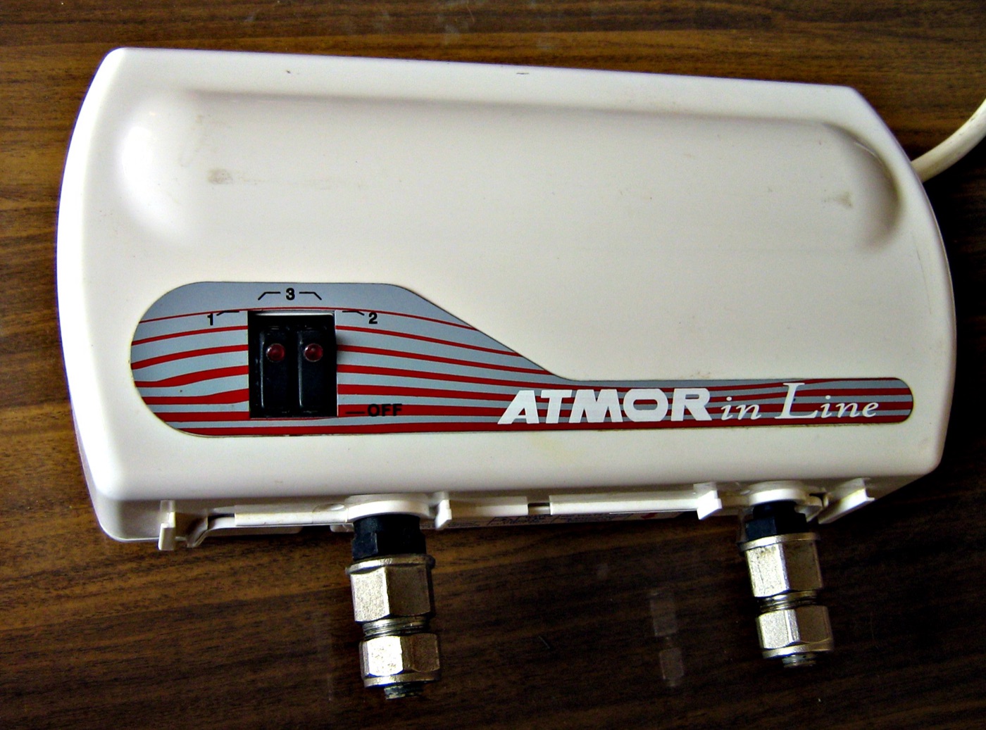 Real photograph of an Atmor inline electric water heater