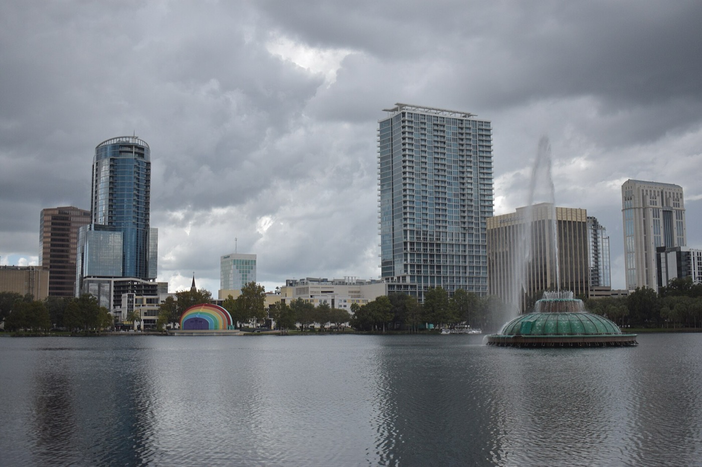 Lake Eola's fountain and amphitheater in front of the downtown Orlando skyline