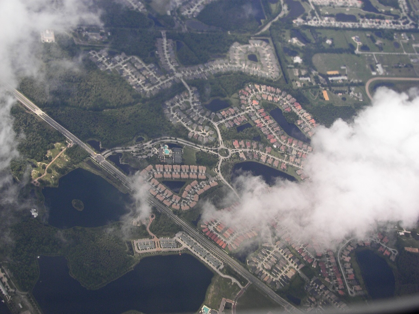 Aerial view of a Westchase, Florida neighborhood of single-family homes around a traffic circle