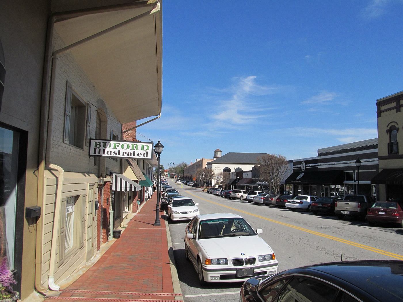 Brick sidewalk and storefronts along Main Street in downtown Buford