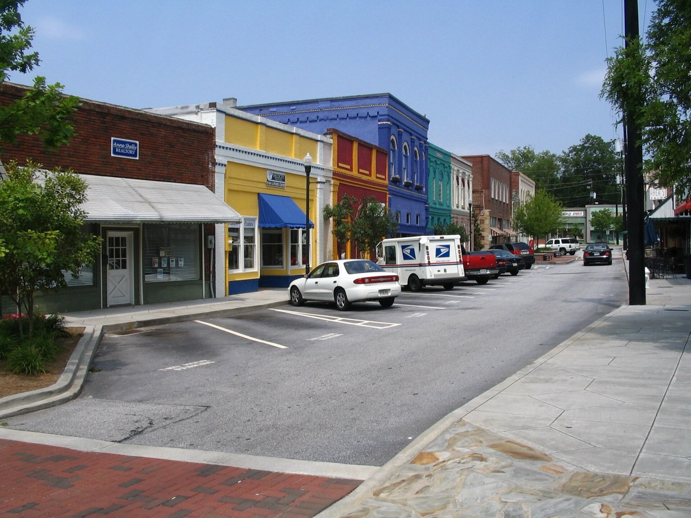 Colorful storefronts along a street in Olde Town Conyers