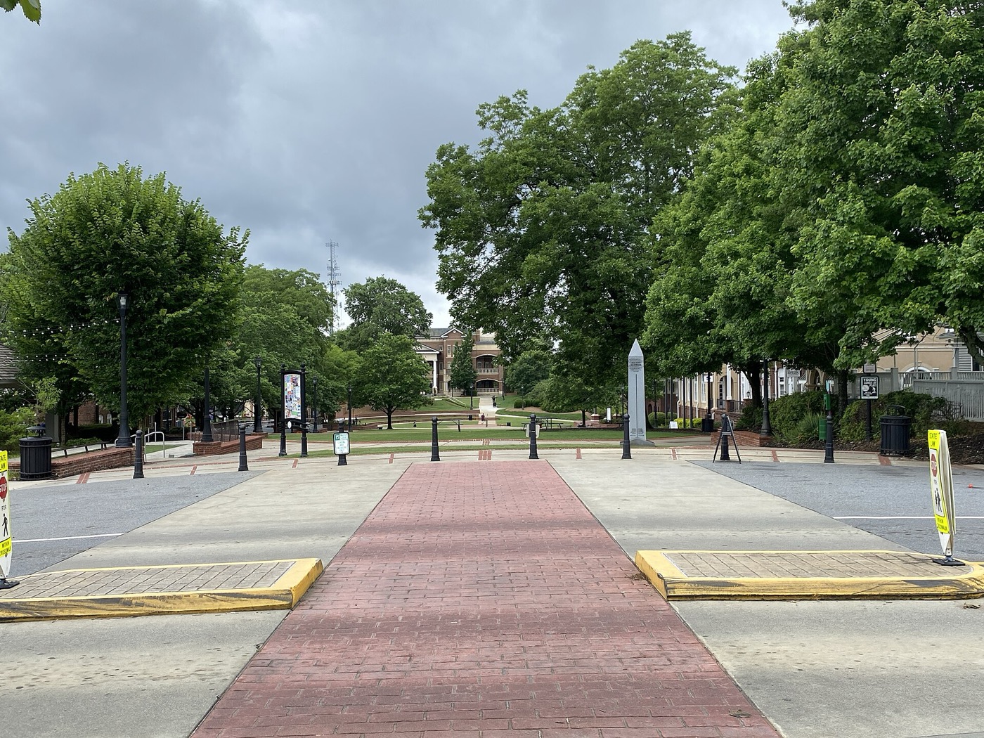 Brick walkway leading across downtown Duluth's town green toward City Hall