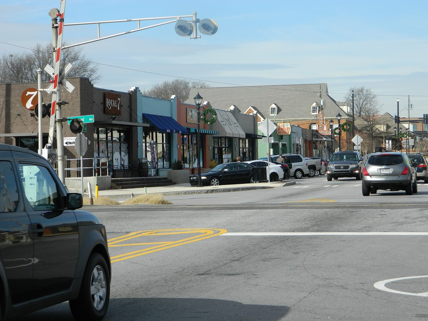 Shops along Main Street in downtown Tucker next to a railroad crossing