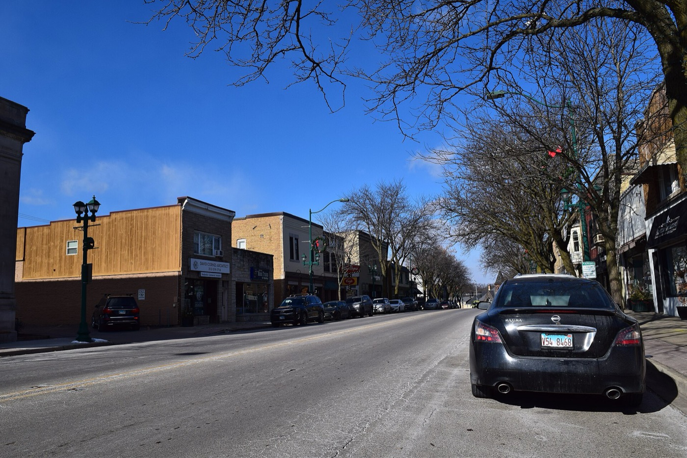 Shops and parked cars along Route 83 in downtown Antioch