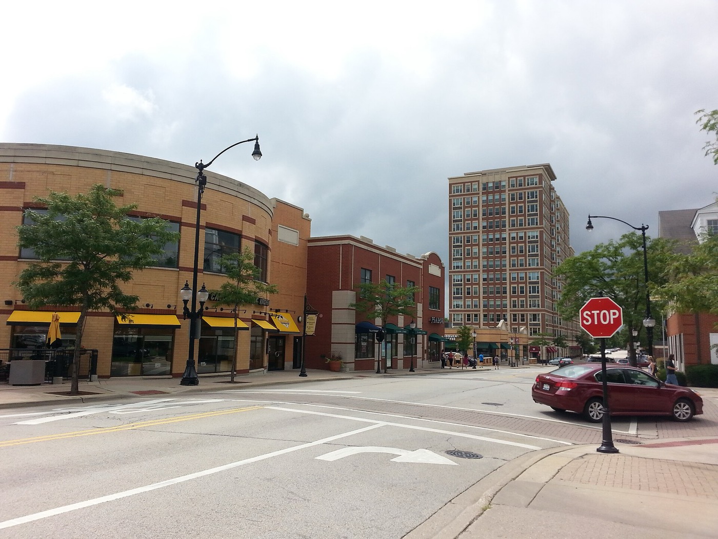 Downtown Arlington Heights street corner with shops and a mid-rise building