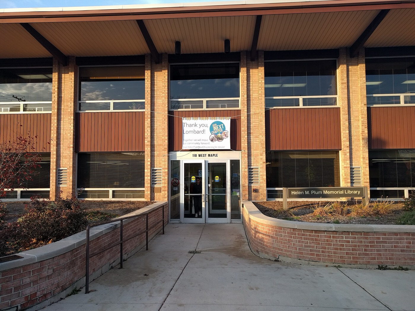 Brick and glass entrance of the Helen M. Plum Memorial Library in Lombard