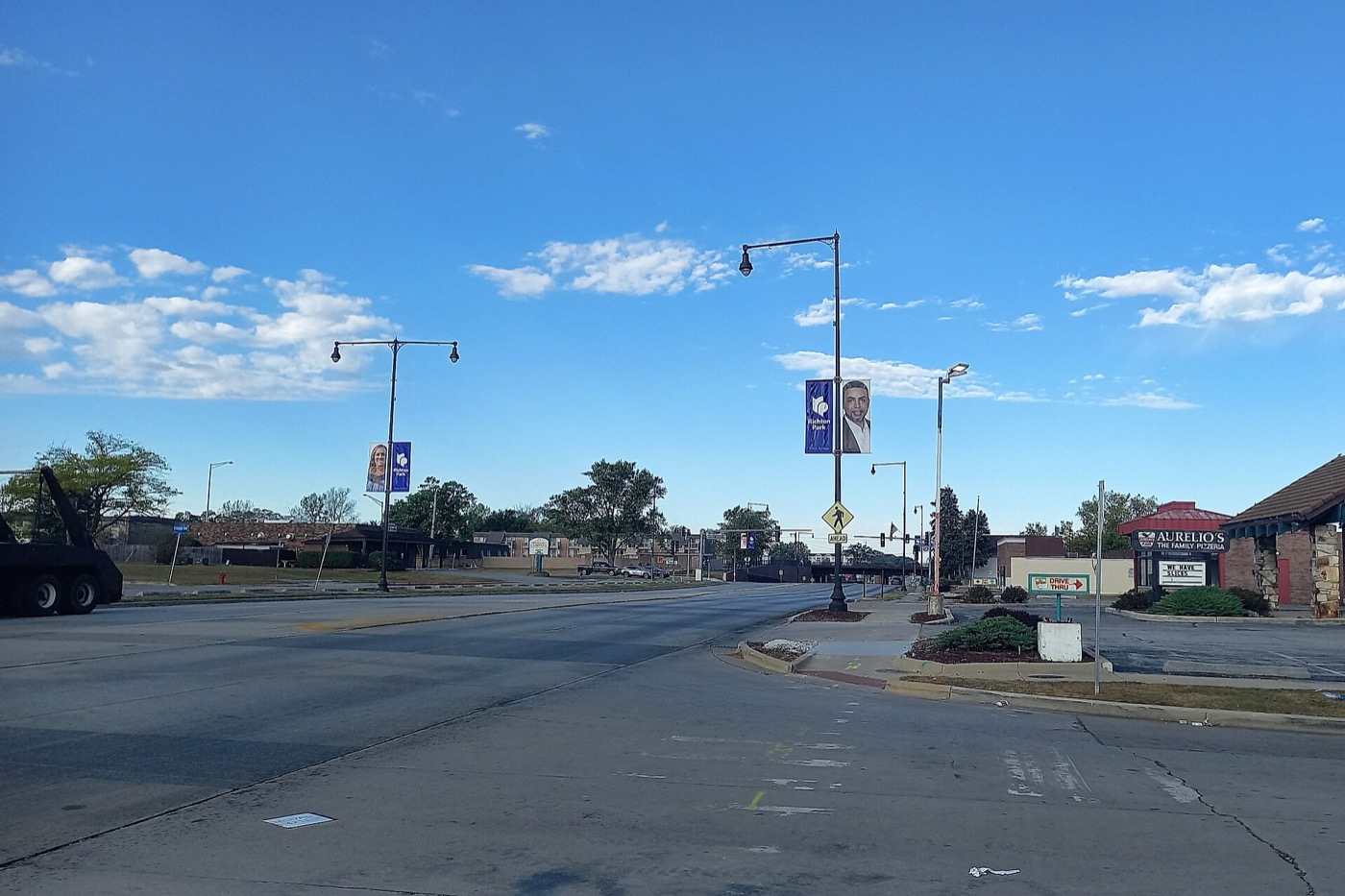 Wide intersection on Sauk Trail in Richton Park under a blue sky