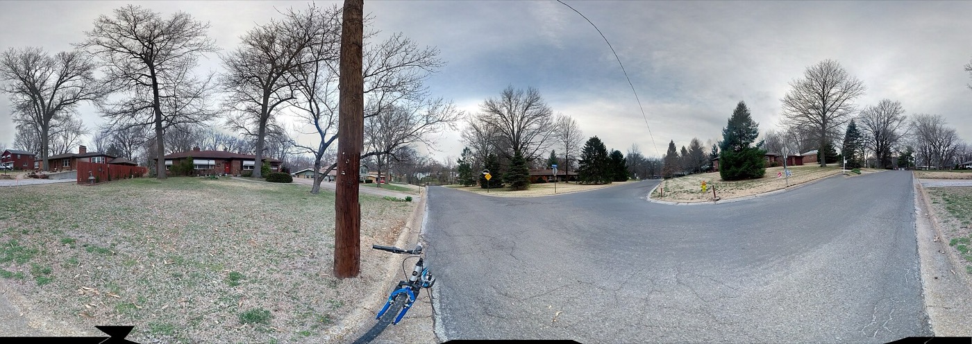 Panoramic view of a residential street with brick ranch homes in Swansea, Illinois