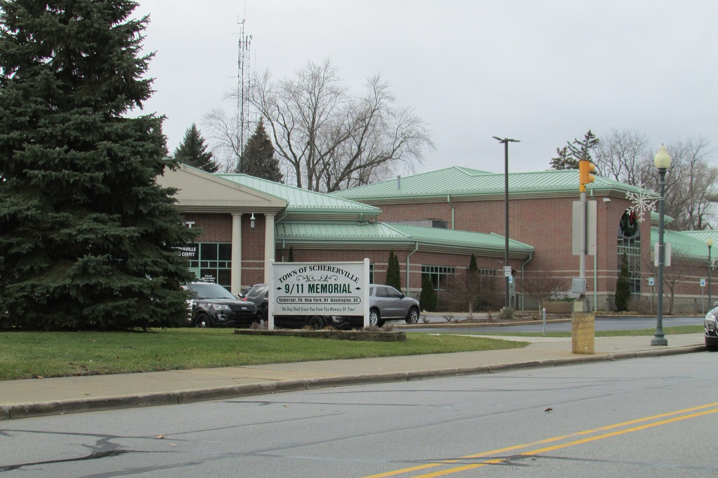 Schererville town hall building with a memorial sign out front