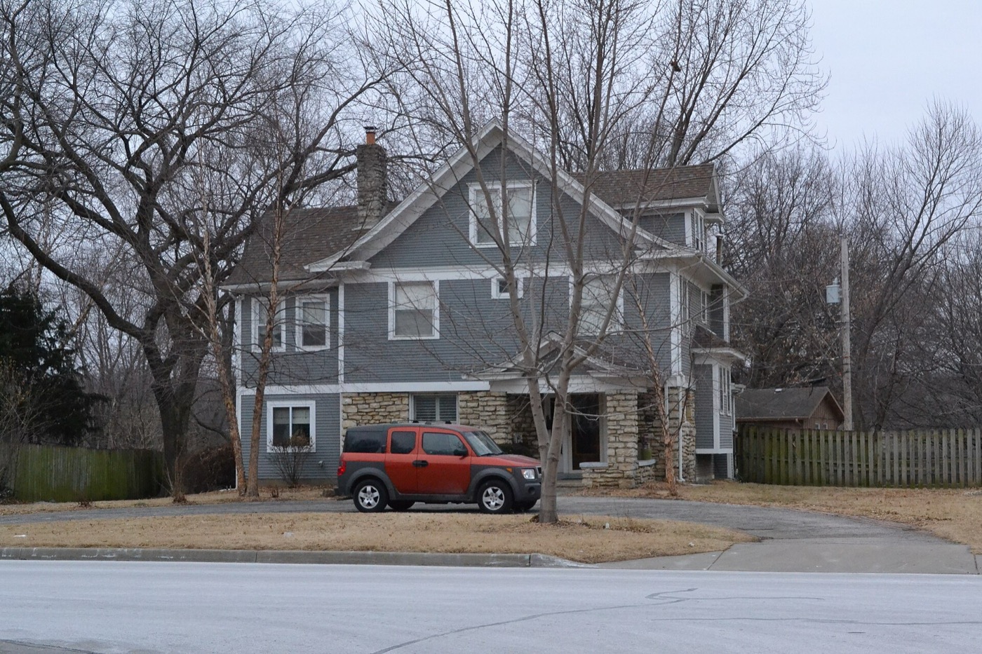 Gray two-story house with stone accents, listed on the National Register of Historic Places, in Merriam, Kansas