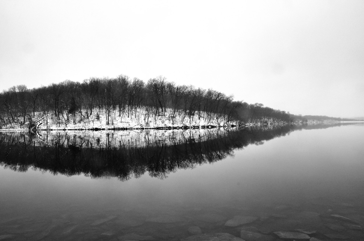 Frozen lake and bare trees at Shawnee Mission Park in Shawnee, Kansas