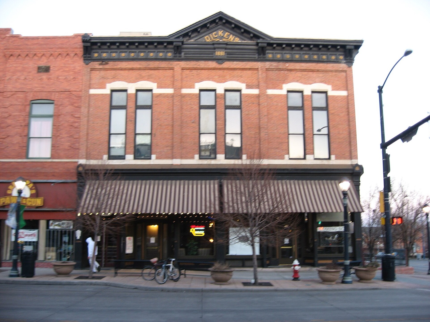 Historic red-brick Dickens Opera House building on Main Street in downtown Longmont