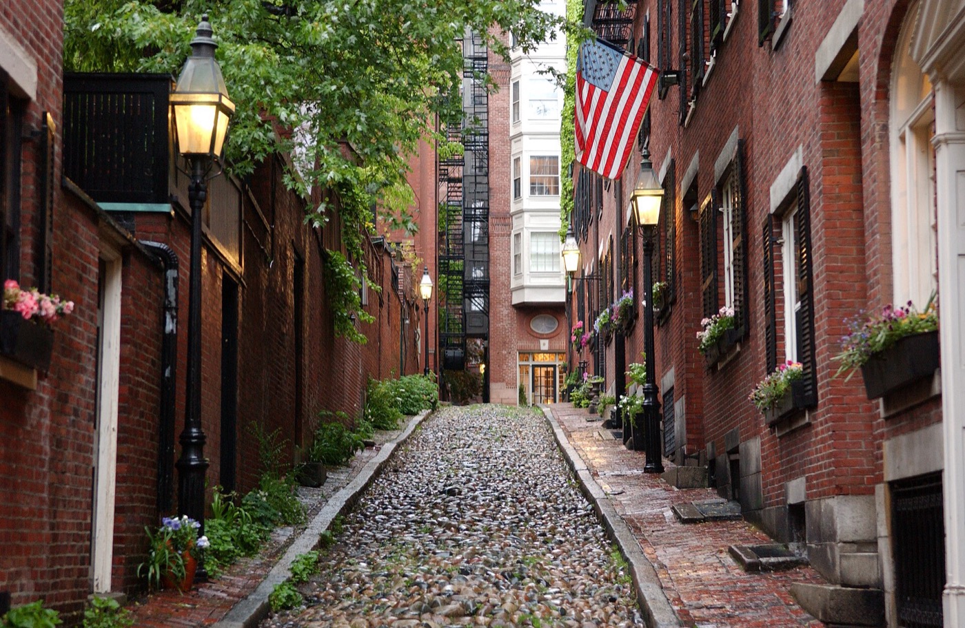 Brick rowhouses on a street in Boston's Beacon Hill neighborhood