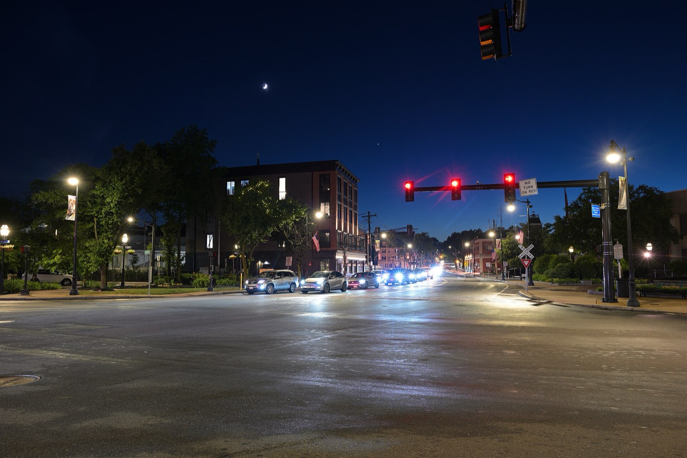 Looking down Lowell Street in Peabody Square with the rail crossing