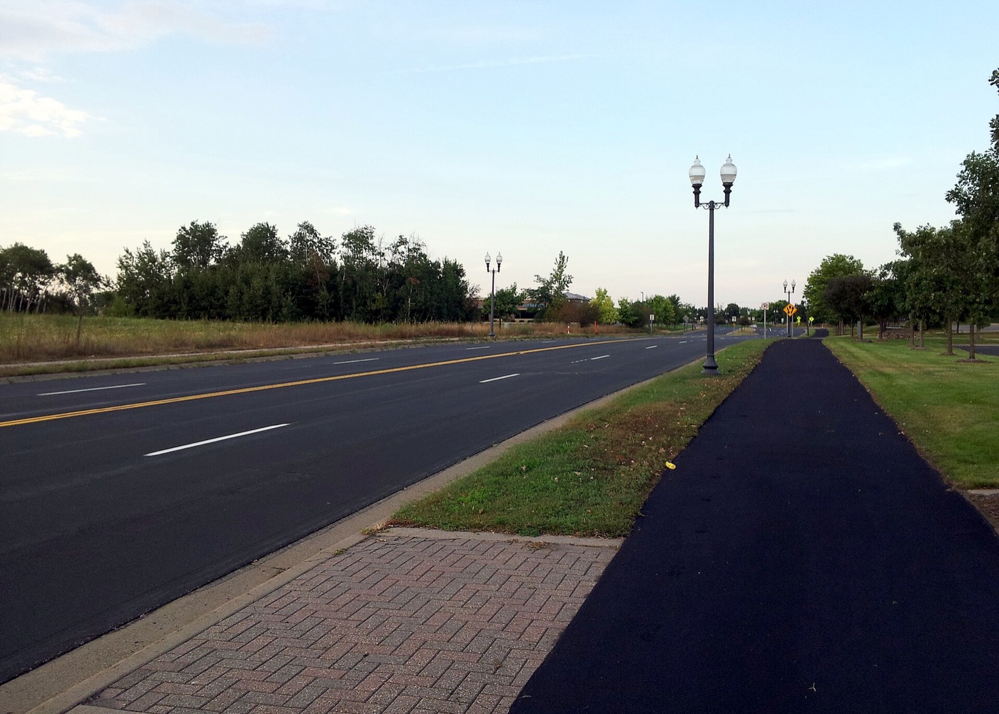 Rice Creek Parkway in Shoreview with a trail, lamp posts and trees