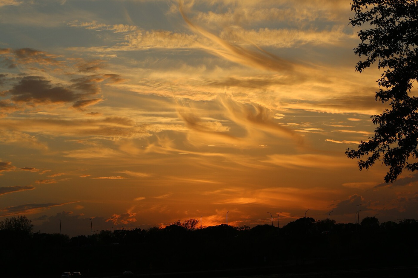 Sunset over Vadnais Lake with trees along the shoreline in Vadnais Heights