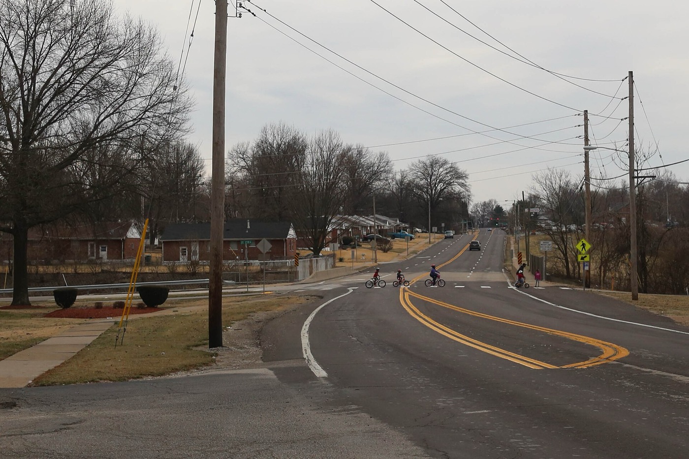 Bellefontaine Road with bike lanes and trees in Bellefontaine Neighbors, Missouri