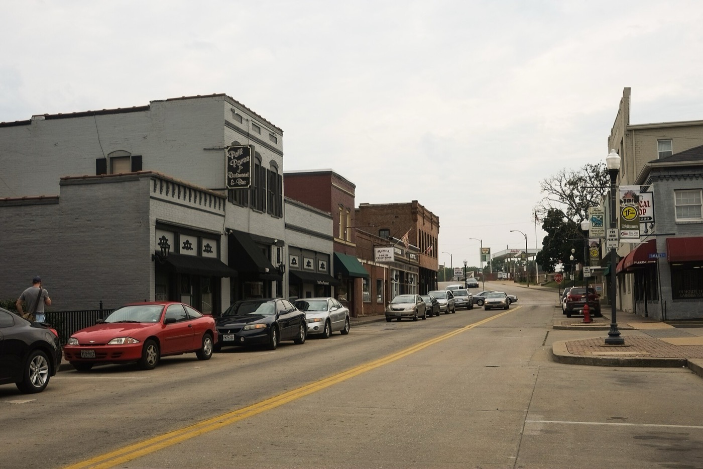 Storefronts and parked cars along Main Street in Festus, Missouri