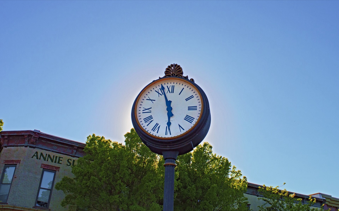Street clock and storefronts in downtown Lee's Summit, Missouri