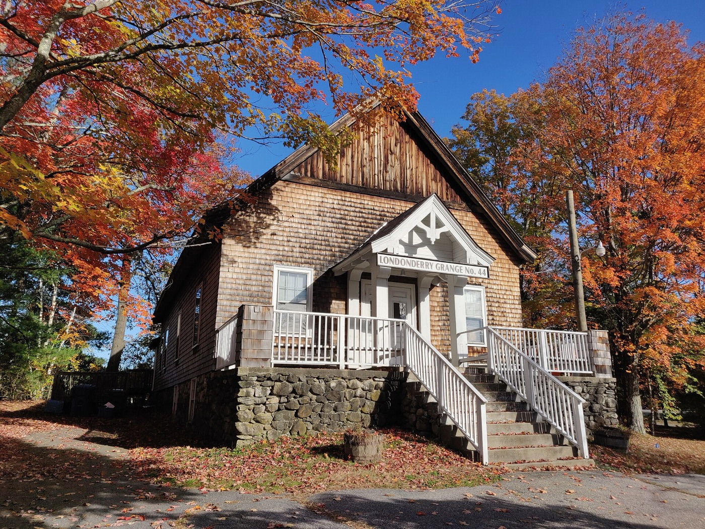 Grange hall in Londonderry, New Hampshire, with autumn foliage