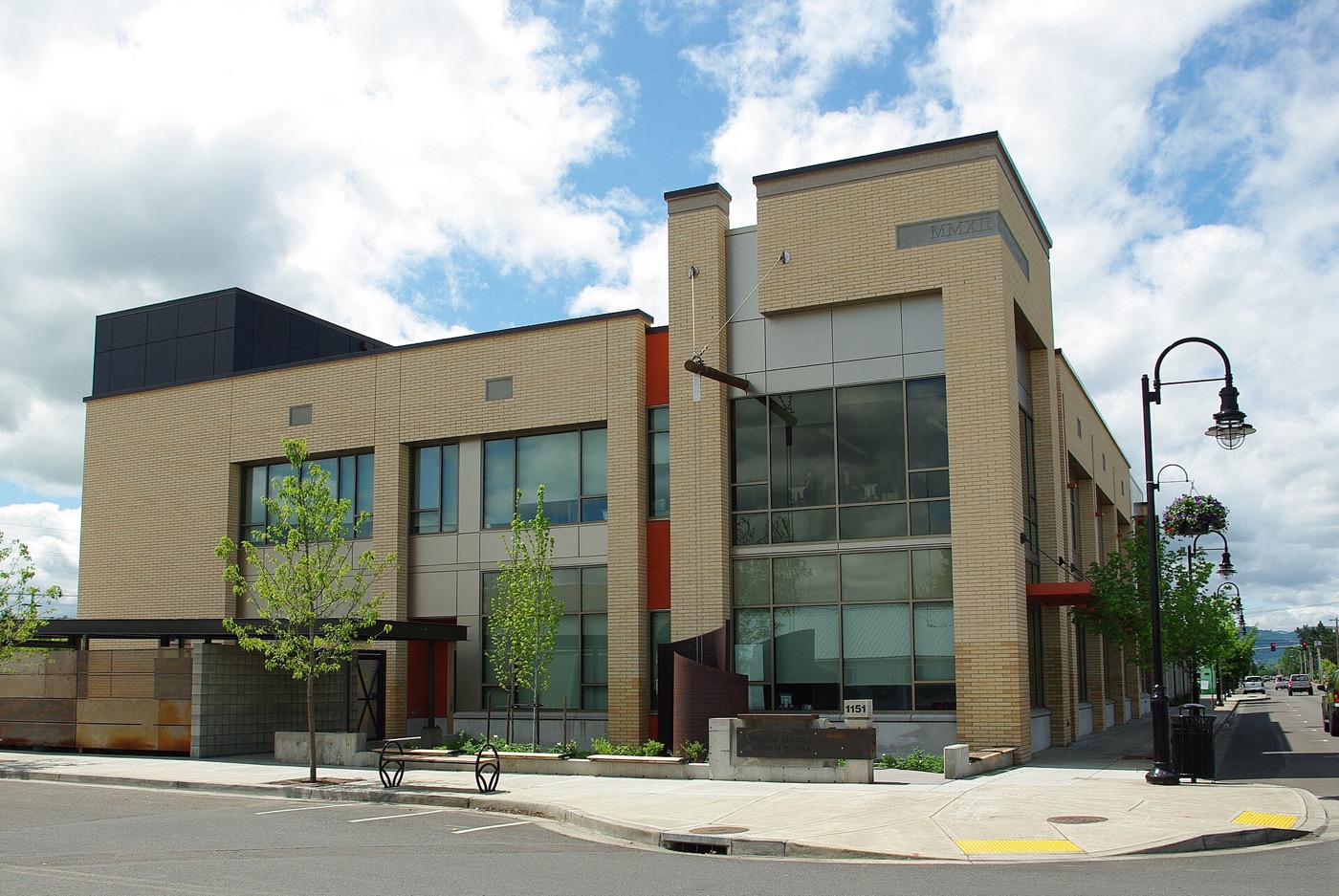 Modern two-story clinic building on a street corner in Cornelius, Oregon