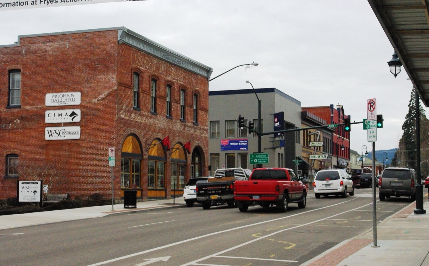 Pacific Avenue in downtown Forest Grove lined with street trees and storefronts