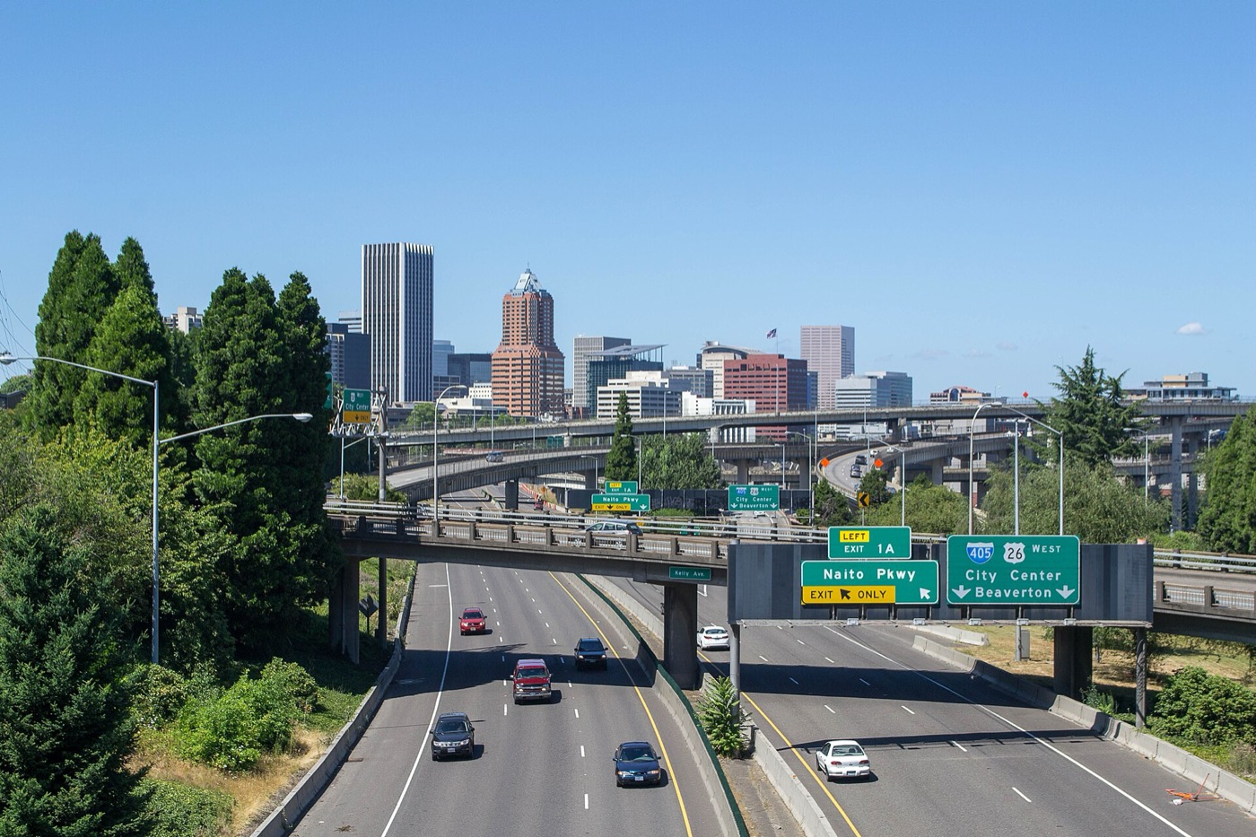 Downtown Portland towers seen from the Ross Island Bridge with Interstate 5 ramps in the foreground