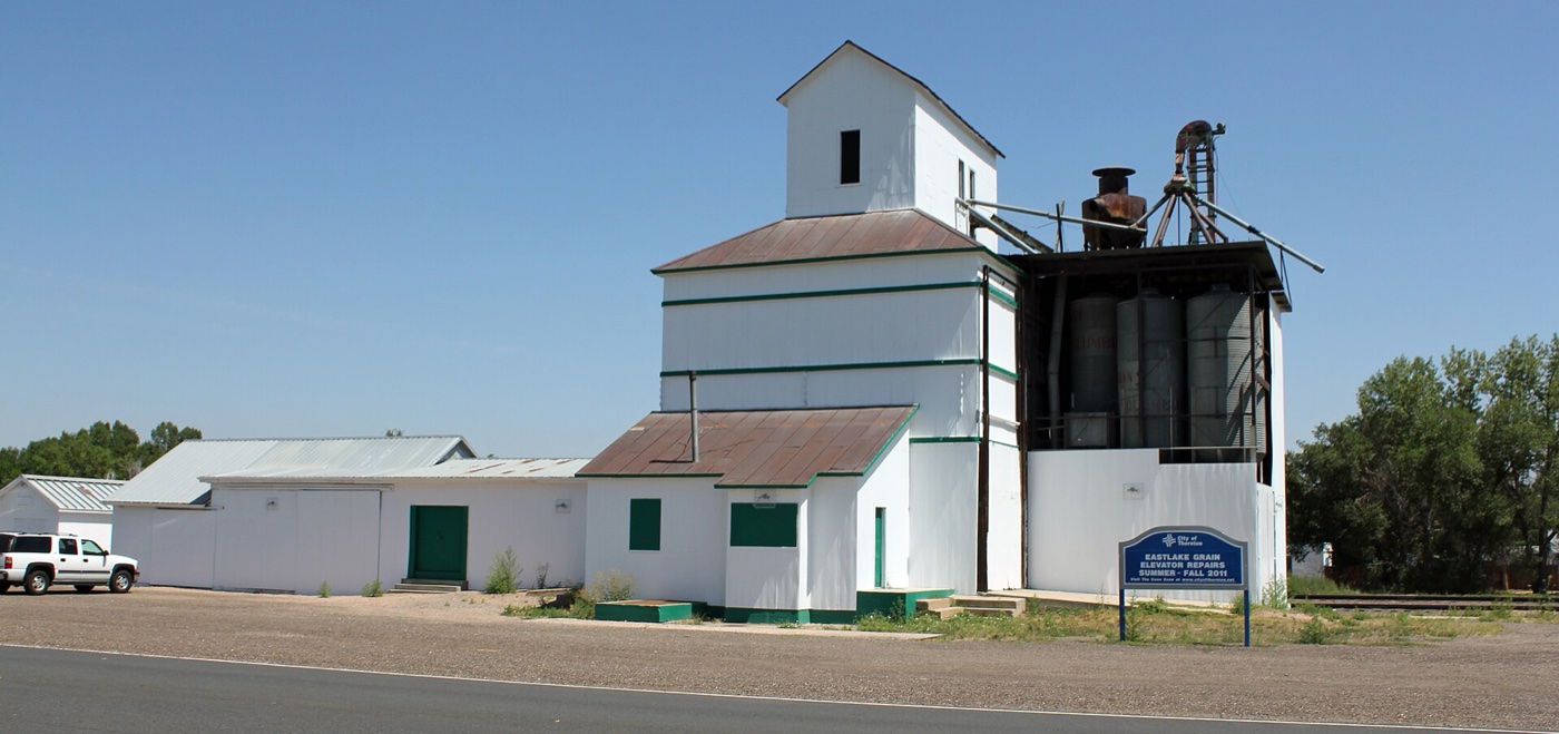 White historic wooden grain elevator of the Eastlake Farmers Co-Operative in Thornton's Eastlake area
