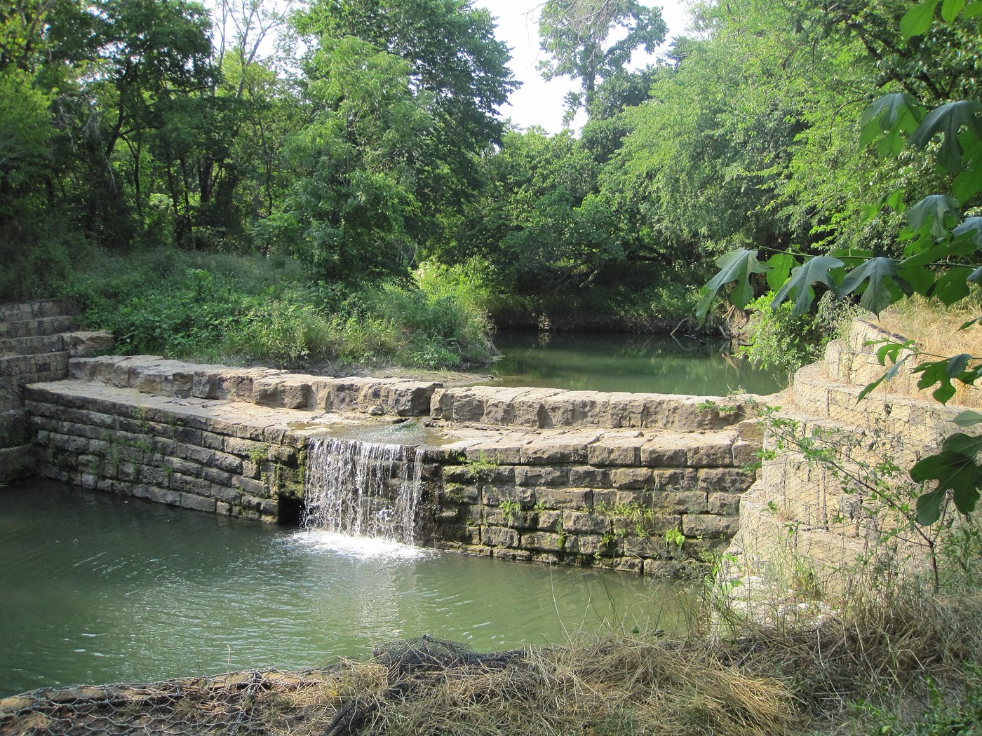 Historic stone dam of the Allen railroad water station in Allen, Texas