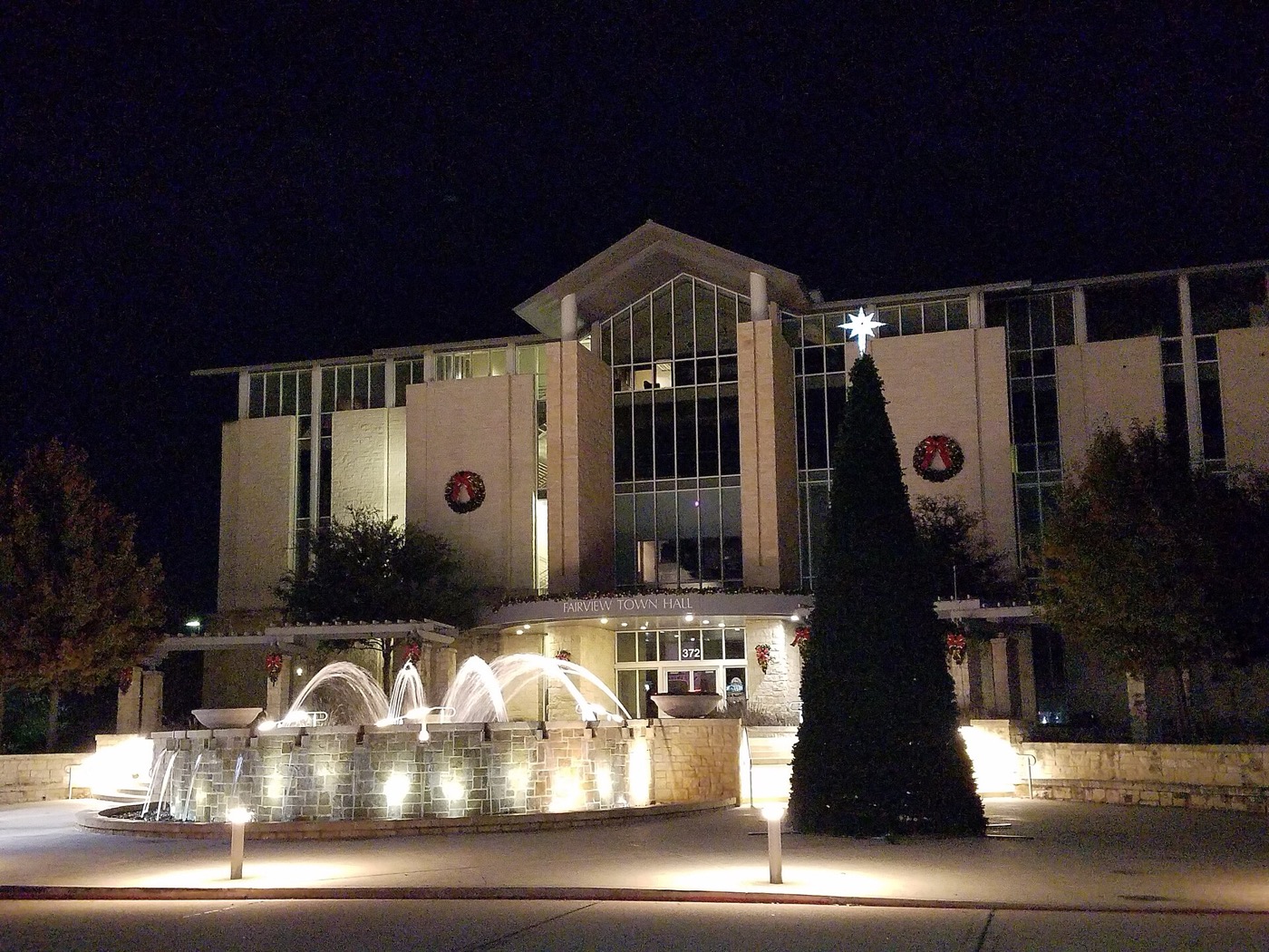 Fairview, Texas Town Hall lit at night with holiday decorations