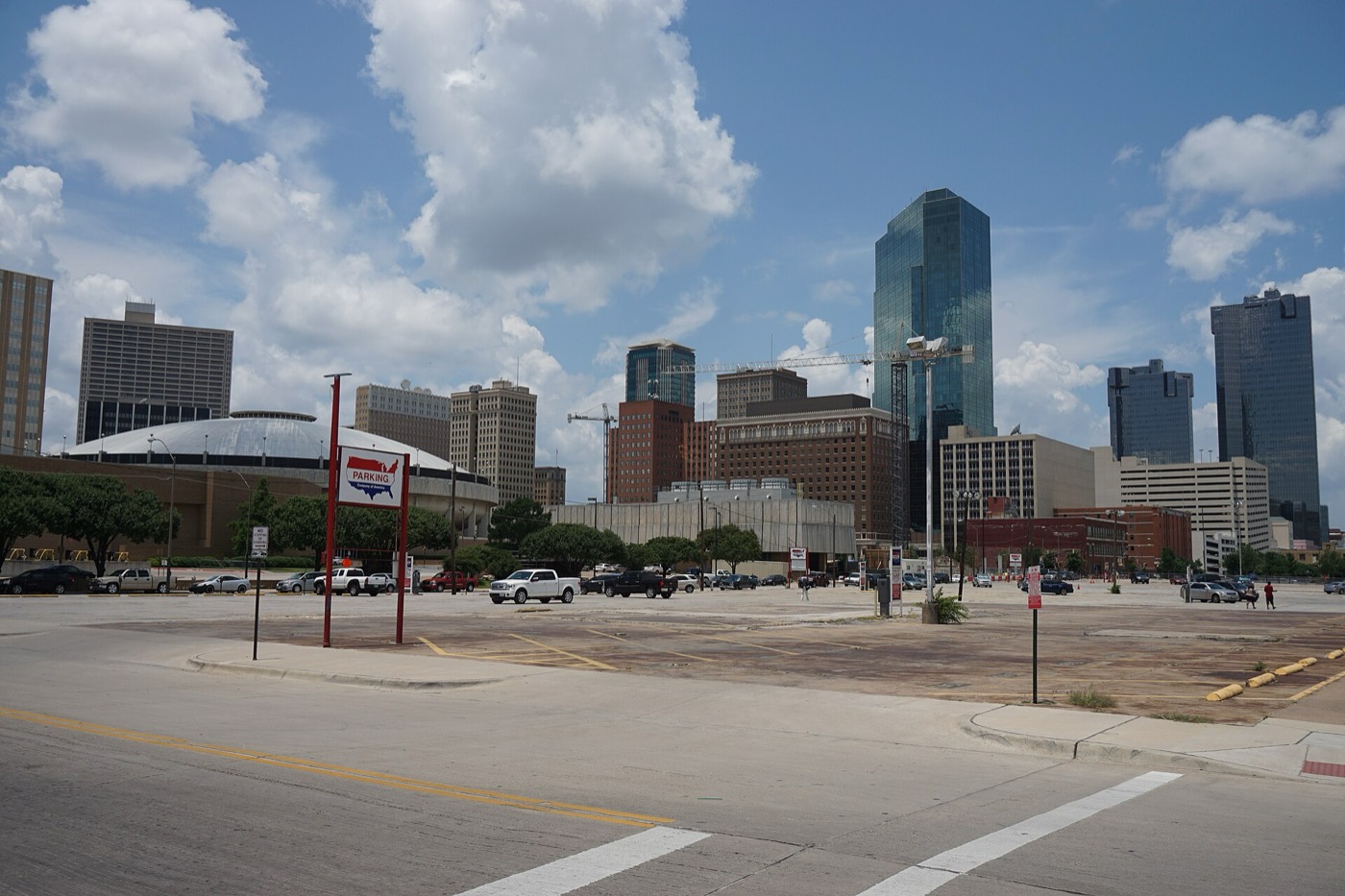 Downtown Fort Worth skyline with high-rise towers under a partly cloudy sky