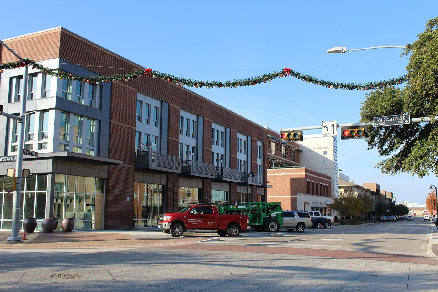Brick mixed-use building and street corner in downtown Garland, Texas
