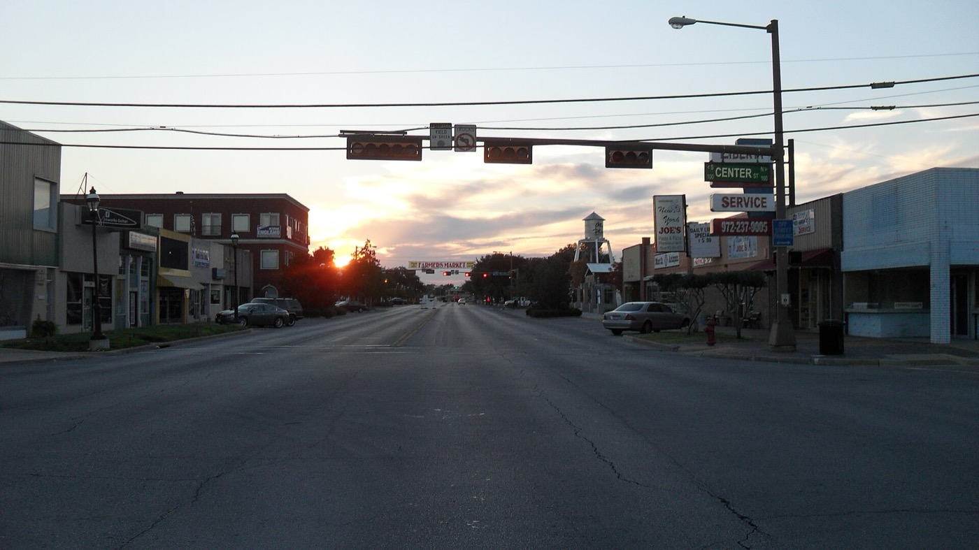 Looking west down Main Street in downtown Grand Prairie at dusk from the Center Street intersection