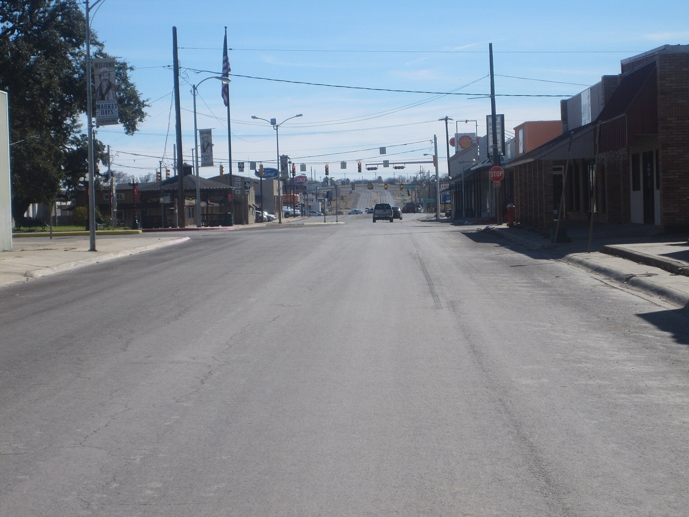 Main street through downtown Pleasanton, Texas, with low commercial buildings