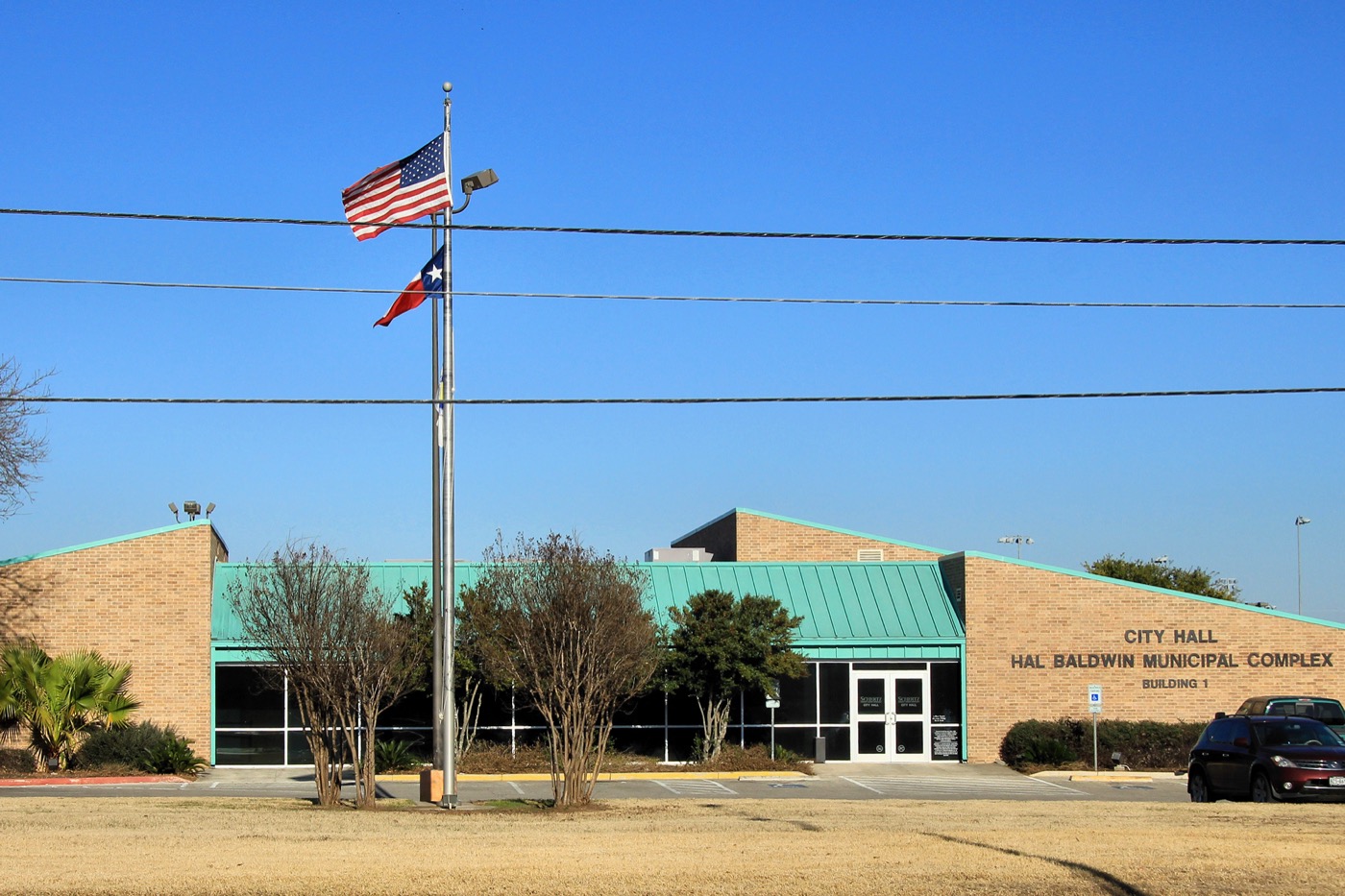 Schertz City Hall, a low brick municipal building with landscaping