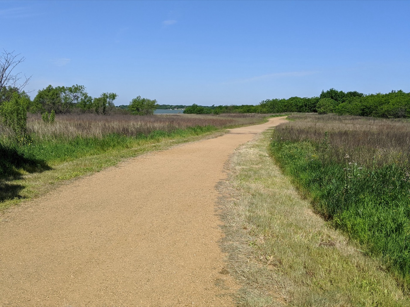 Walking path along Lewisville Lake at Ridgepointe Park in The Colony, Texas