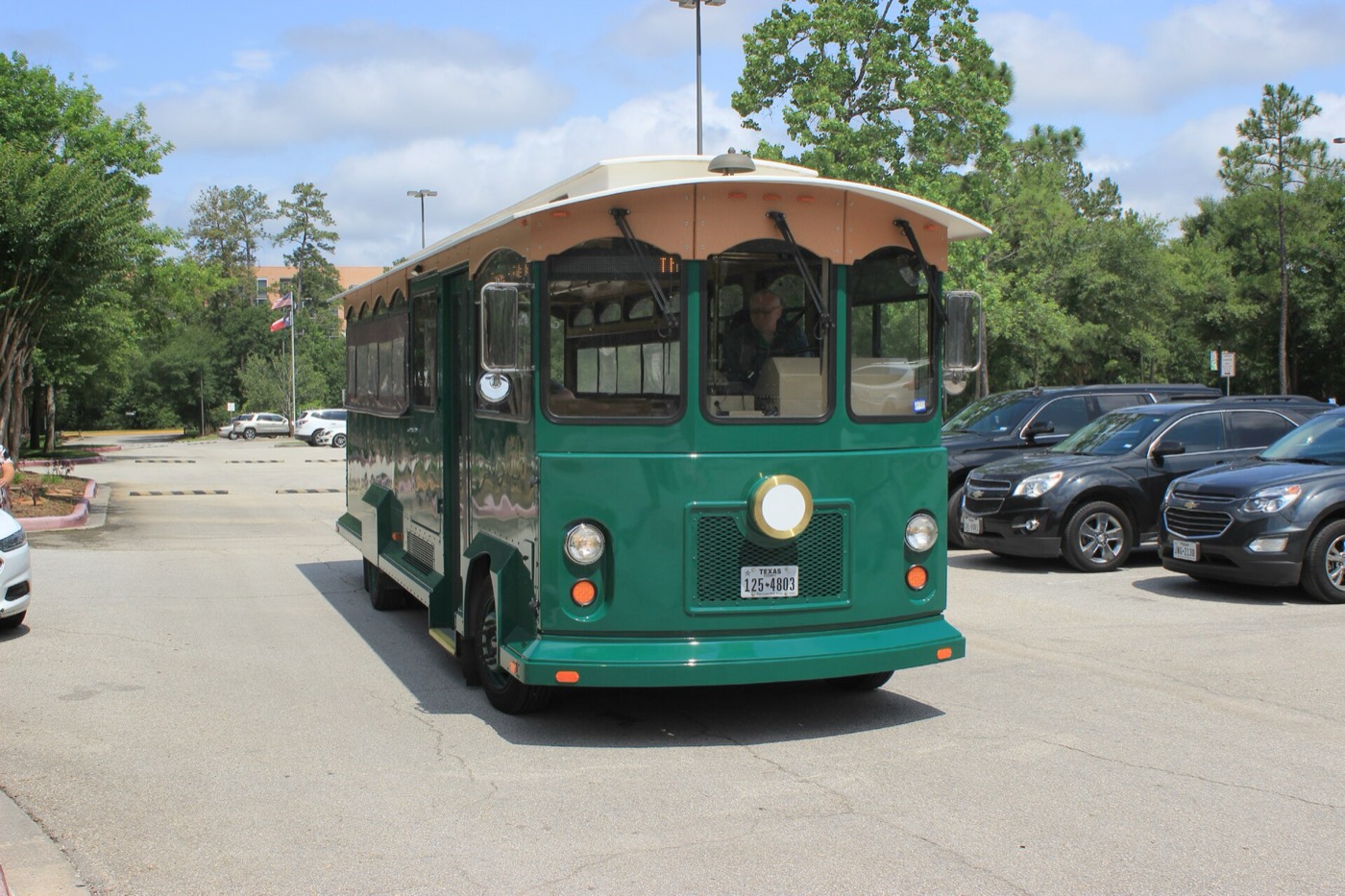 Open-air trolley on a street in The Woodlands, Texas